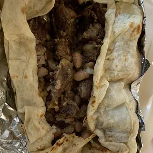 A peak inside my delicious carnitas burrito (regular)