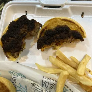 Burnt Hamburger and cold fries.