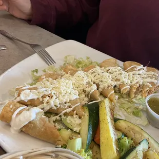 Lunch chicken flautas with veggies  ( but u can get beans &amp; rice instead of grilled veggies ) Damn they are delicious