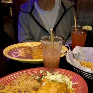 Enchiladas, refried beans, and Mexican rice