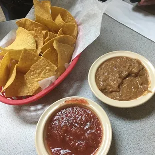 Refried beans served with chips and salsa