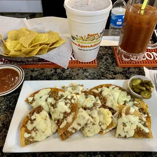 Beef nachos with pickled jalapeños and Bloody Maria made with my favorite mix Zing-Zang.