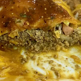 Jalisco Burrito plate with ground beef and rice and refried beans. PACKED FULL WITH GROUND BEEF