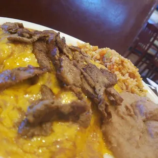 Cheese enchiladas with beef  fajitas...on top