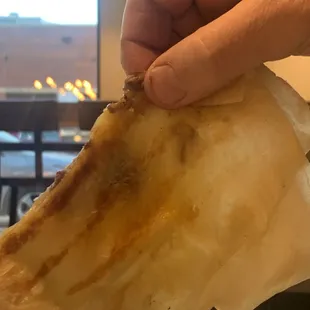 Held up to the light, you can see the contents. "Steak" quesadilla.