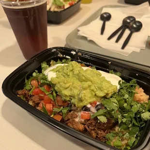 a plate of food and a drink on a table