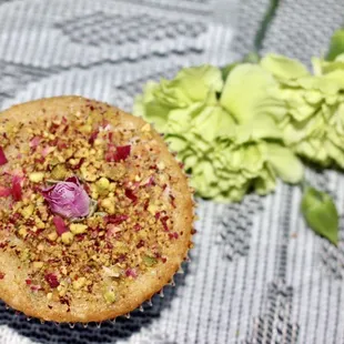 a muffin with pistachios and cranberries