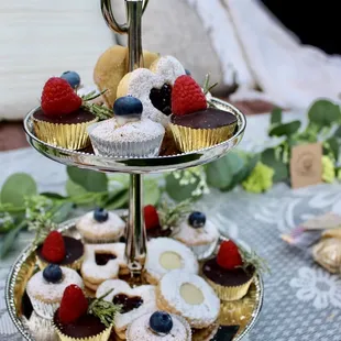 three tiered tray of cupcakes