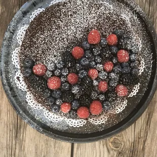 Pinot Noir Flourless Chocolate Cake with fresh Berries and sugar dust