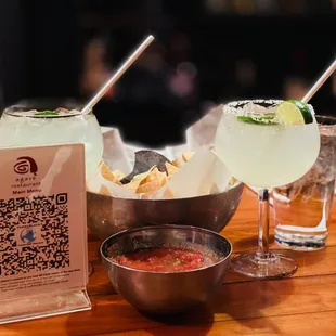 a table with drinks and a qr code