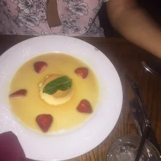 Traditional Creme Caramel Flan with Sliced Strawberries