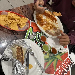 Breakfast burrito . Chicken enchiladas. Chips and salsa . Yummy goodness