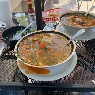 two bowls of soup on a table