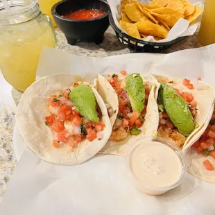 4 shrimp tacos with passion fruit Margarita.