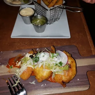 a plate of food on a wooden cutting board