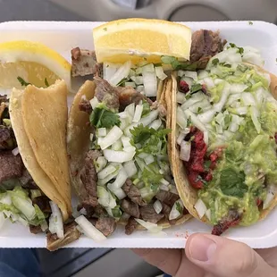 From left to right: carnitas 5/5, carne asada 2.5/5, al pastor 4/5. Didn&apos;t expect to get lemons on the side lol