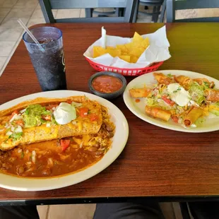 Wet Chile Colorado Burrito on left and Chicken Taquitos on the right, with complimentary chips and salsa in the middle at Agave Taqueria