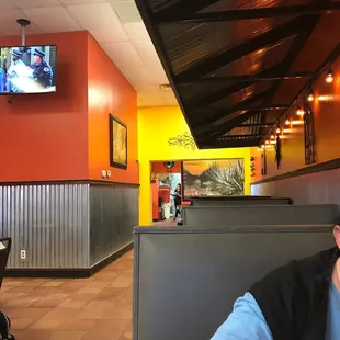a man sitting at a table in a restaurant
