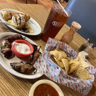 Jalapeño poppers wrapped in bacon and cheesecake empanada.