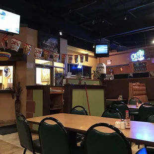 the inside of a restaurant with tables and chairs