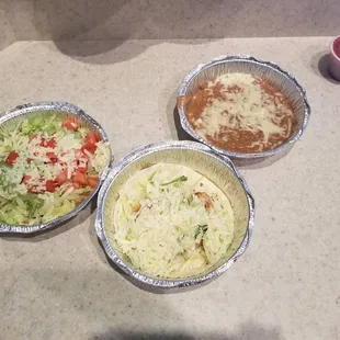 Refried beans shrimp taco and chalupa with chips and salsas