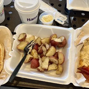 Biscuits &amp; gravy with bacon, home fries, and a side pancake.