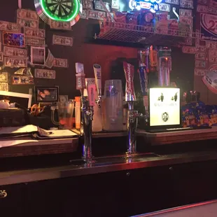 a bar with neon signs