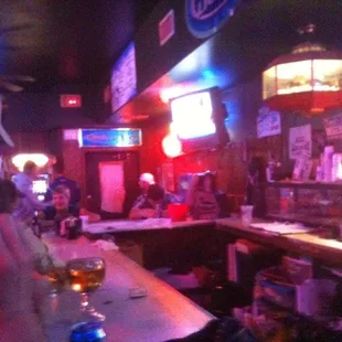 a man wearing a face mask at a bar