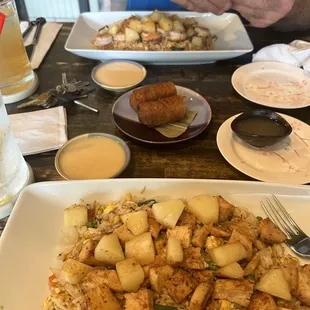 a man taking a picture of a plate of food