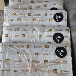 a stack of packages wrapped in plastic