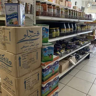 a grocery aisle with boxes of food