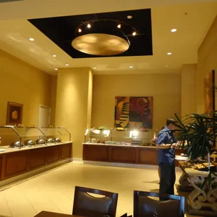 Breakfast buffet bar w/pancakes, waffles, french toast, bacon, sausage hash brwns, fresh fruit, oatmeal &amp; pastries.