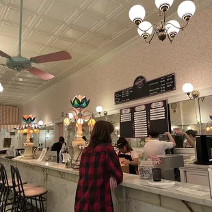 a woman standing at a counter