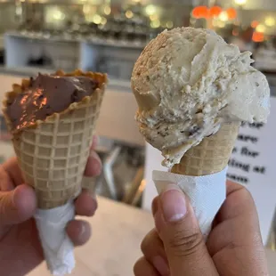 Butter pecan in sugar cone, black raspberry chip in waffle cone (already partially eaten)
