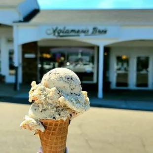 2 scoops of Banana chip on sugar cone, front of store