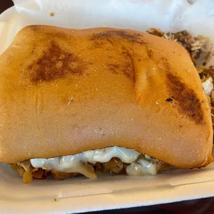 a sandwich in a styrofoam container