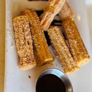 Definitely try the churros .