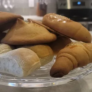 a plate of bread and pastries