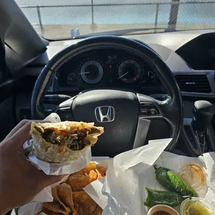 Lakefront carne asada burrito with a side chips and jalapenos! Can't beat that view!