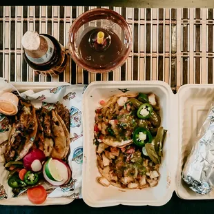 The gang. Quesabirria, steak and shrimp burrito, fish tacos, and michelada