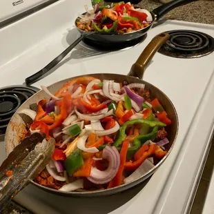 a pan of vegetables on a stove