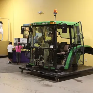 Never been in a tractor before? Jump in the tractor cab inside AgVentures!