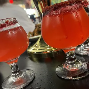 a close up of two glasses of wine