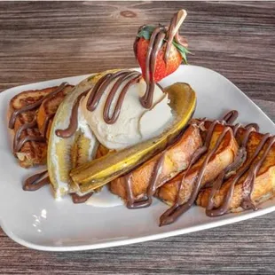 a banana split with ice cream and chocolate sauce