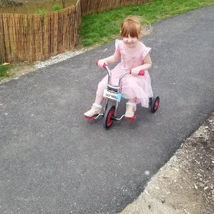 This is part of the outside play area,  there is a nice track and plenty of balance bikes and tricycles for everyone.