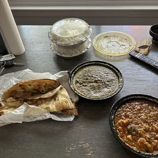 Lamb saag, garlic naan, cauliflower &amp; potato masala