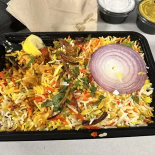 a tray of rice and vegetables