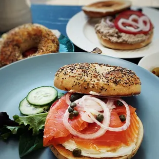 a bagel sandwich with salmon and capers