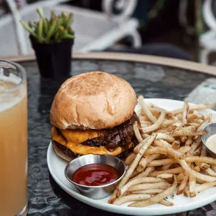 AhbA Burger: 2 smashed wagyu patties, caramelized onions, american cheese, pickles, fresno chilis, garlic aioli + fries