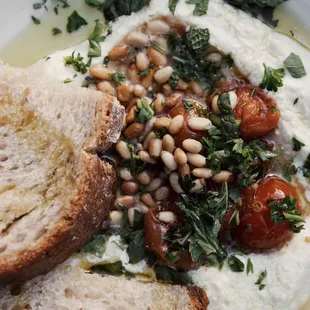 Whipped feta with jammy tomatoes, pine nuts + herbs